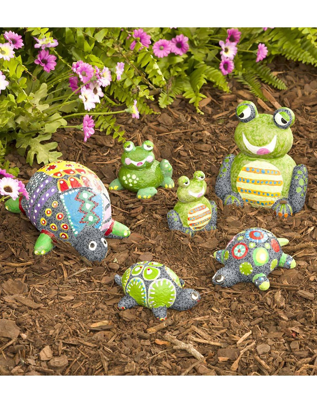 Color Pops® Paint-Your-Own Rock Pets: Turtles and Frogs - completed suggested project idea on display in a garden