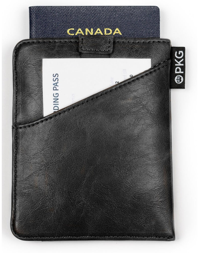 PKG Perry Passport Wallet - black, back view with passport showing sticking out of top and boarding pass in pocket